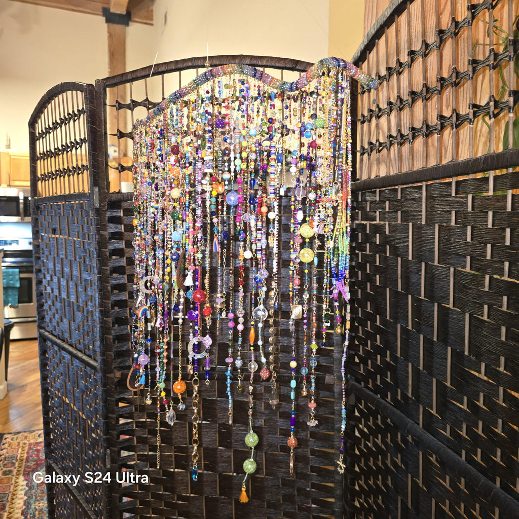 Handcrafted, rhinestone covered driftwood, beaded windchime/suncatcher.