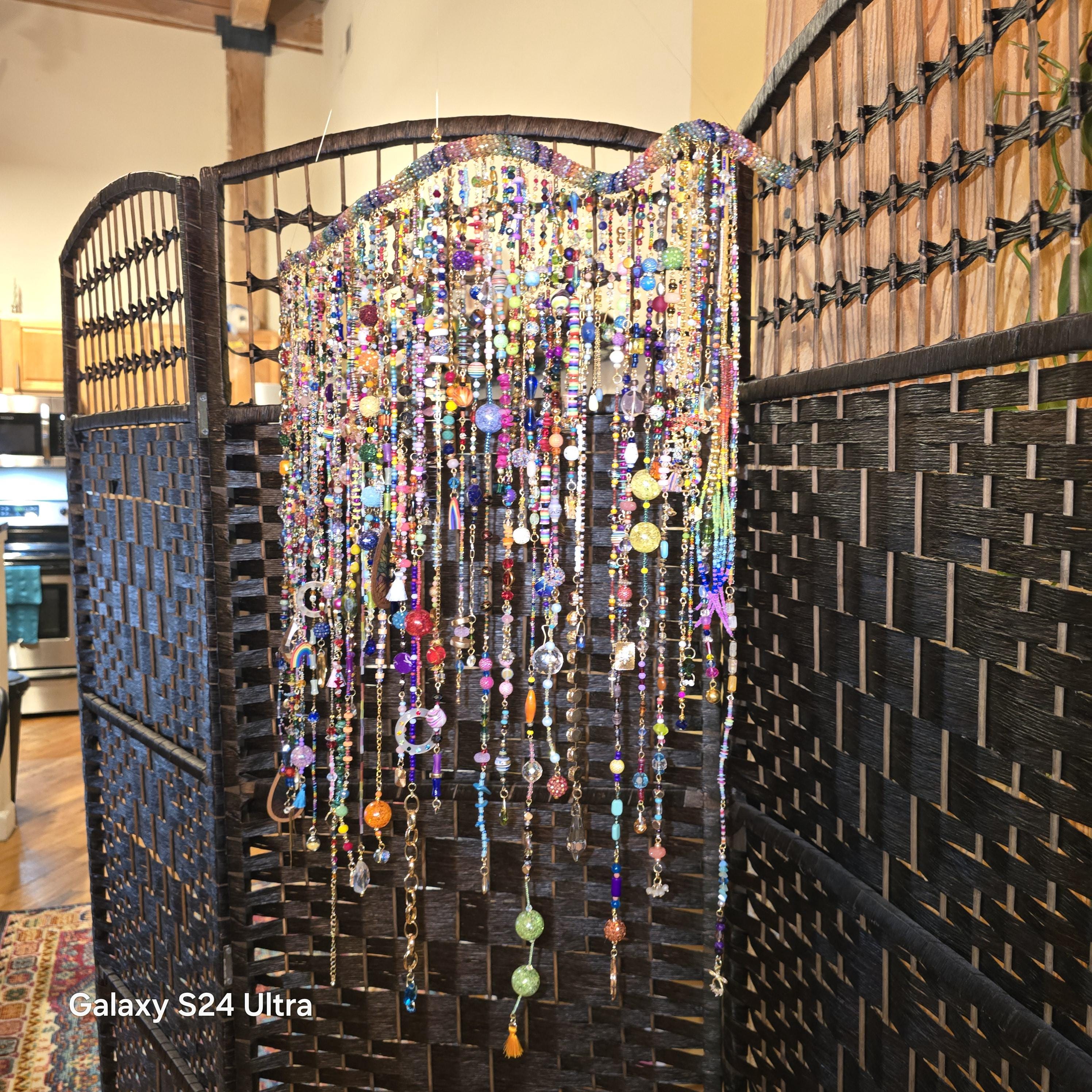 Handcrafted, rhinestone covered driftwood, beaded windchime/suncatcher.