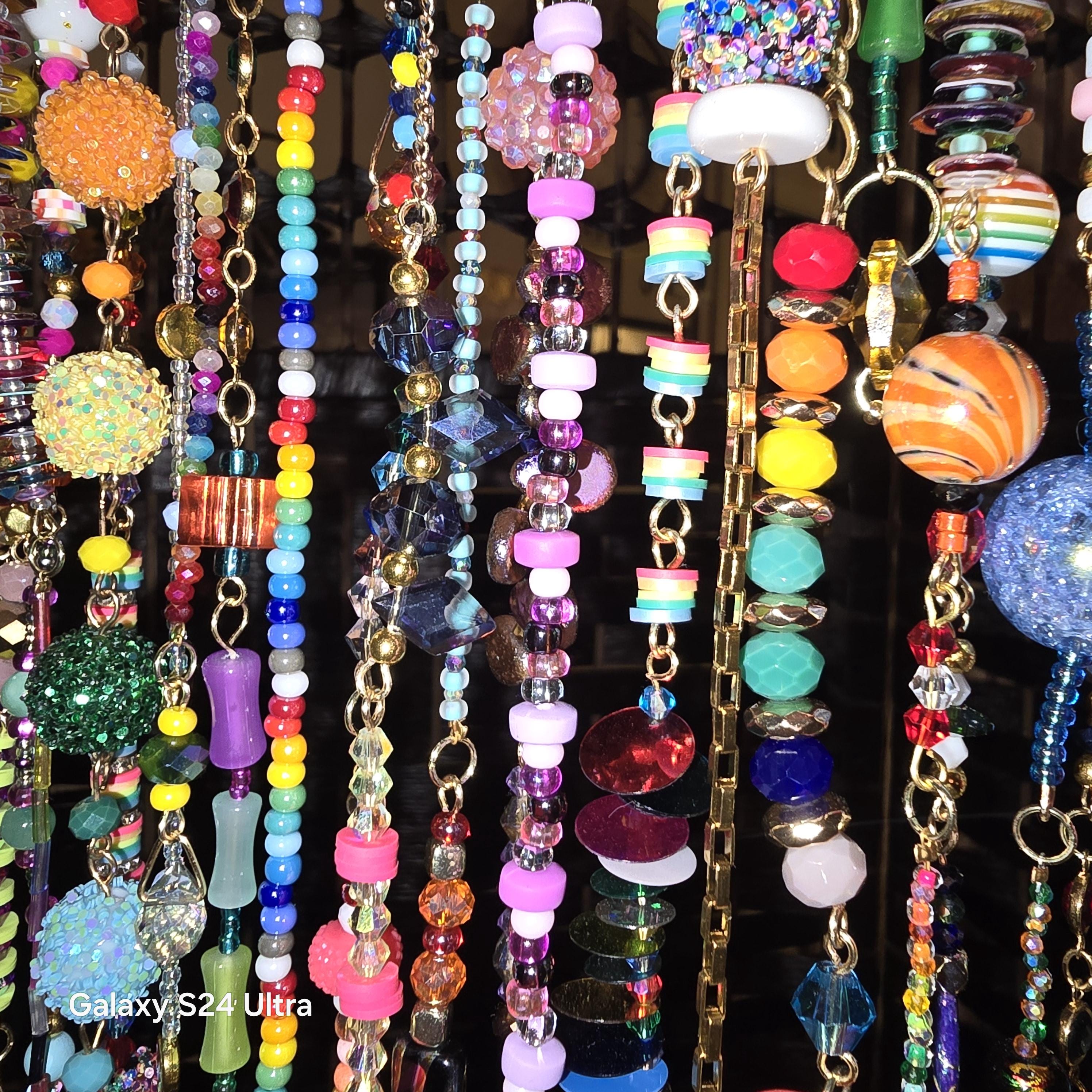 Handcrafted, rhinestone covered driftwood, beaded windchime/suncatcher.